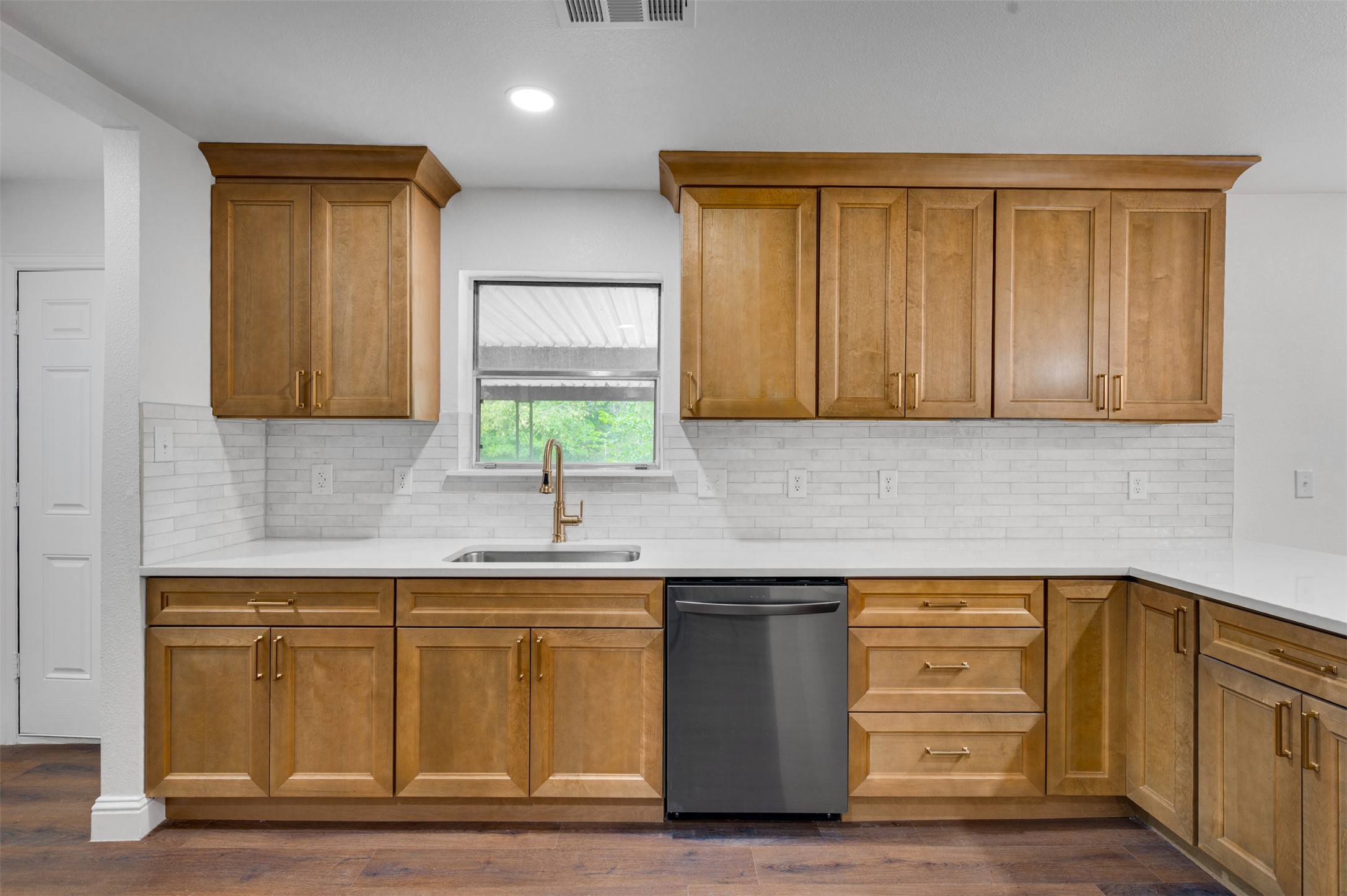 302 An County Road 3914 Palestine, TX 75801 - Photo 13 of 44 a kitchen with a sink and cabinets