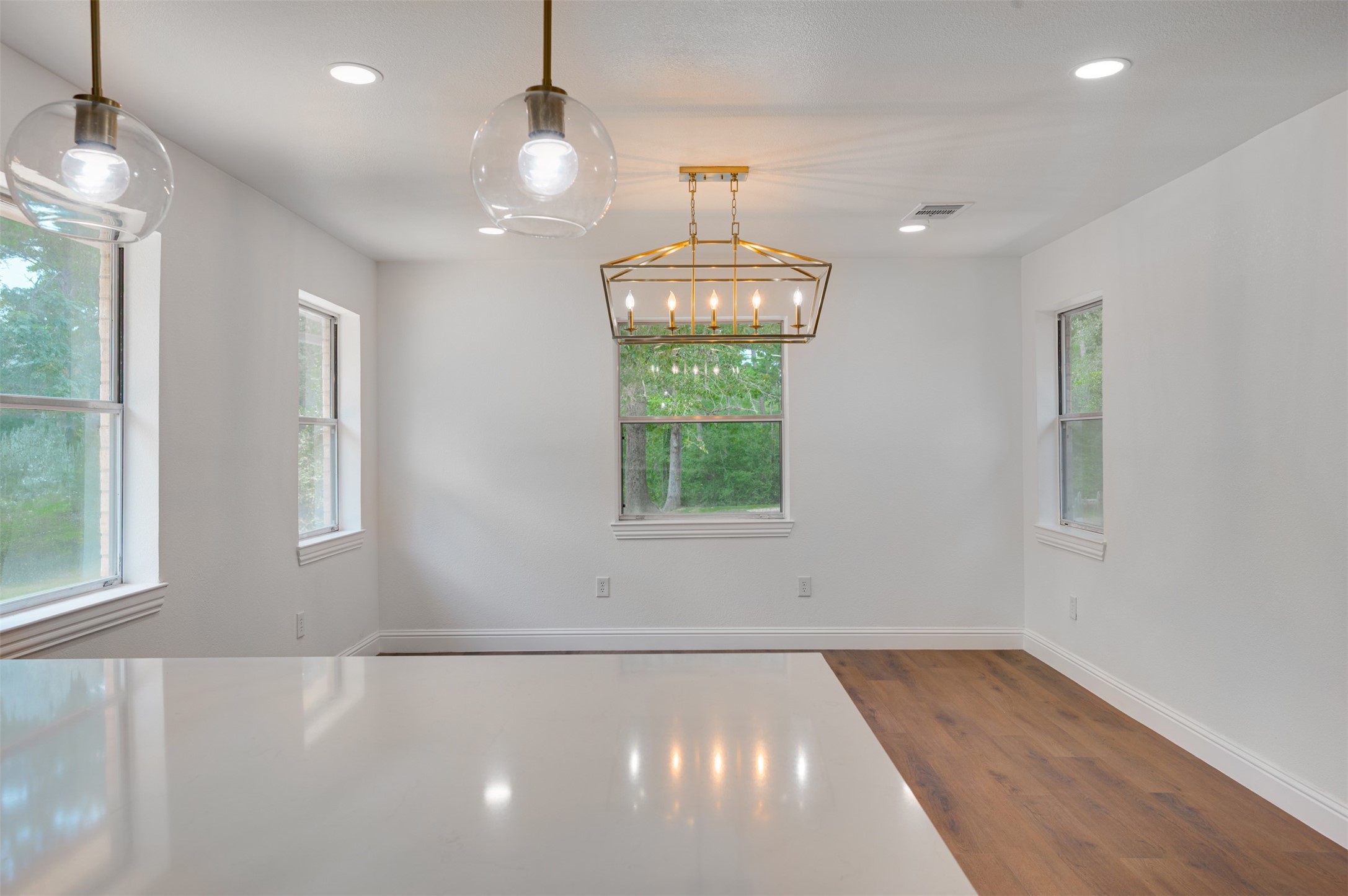 302 An County Road 3914 Palestine, TX 75801 - Photo 17 of 44 a view of an empty room with wooden floor and windows