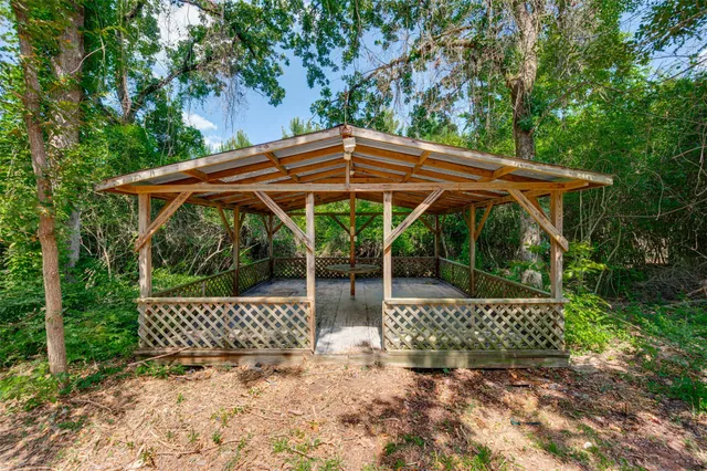 a backyard of a house with lots of green space