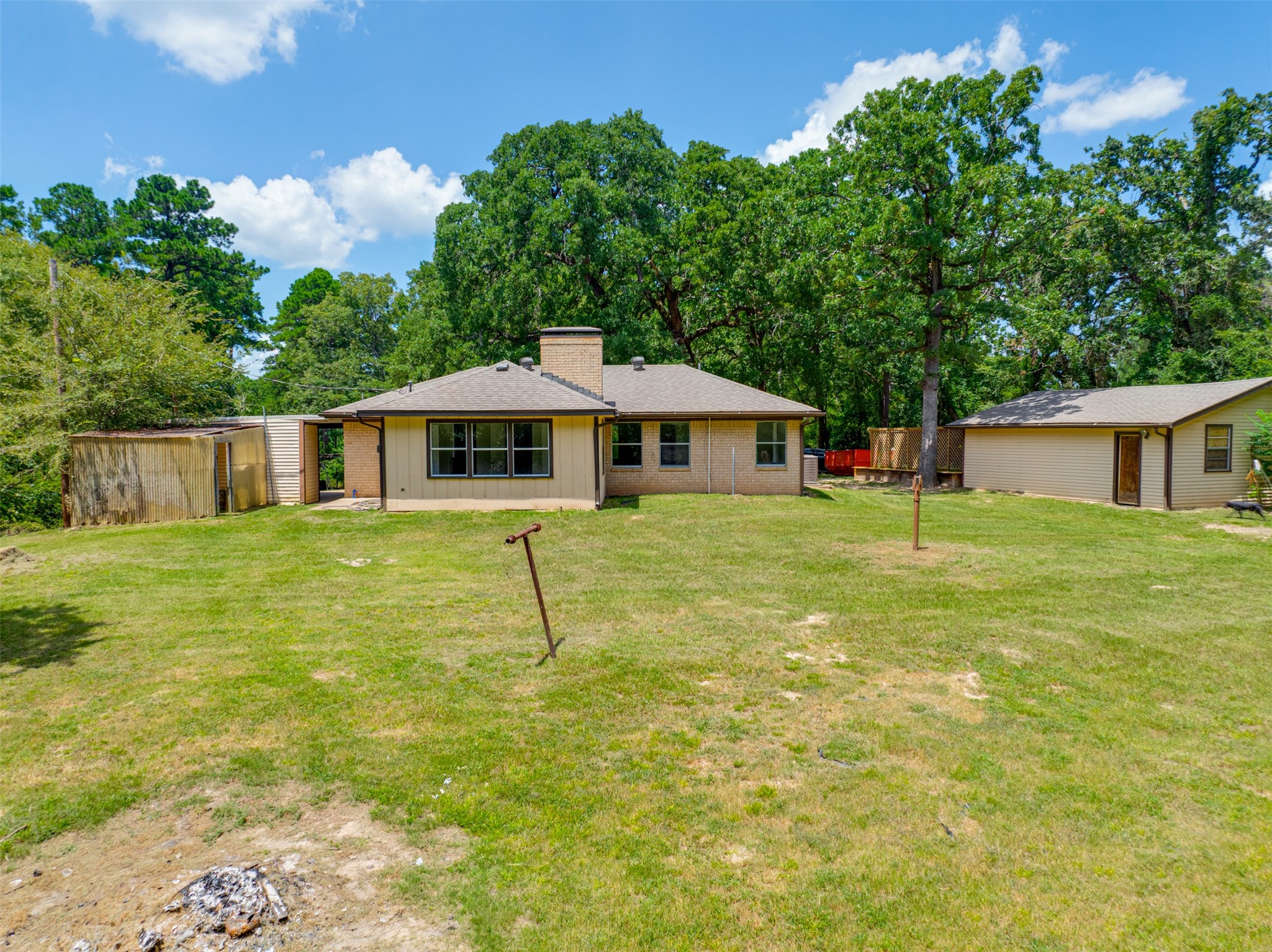 302 An County Road 3914 Palestine, TX 75801 - Photo 38 of 44 a swimming pool with outdoor seating and yard