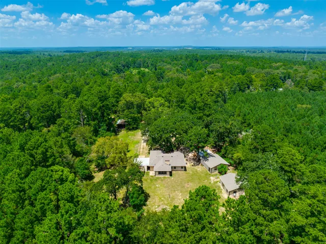 a view of yard with swimming pool and outdoor seating