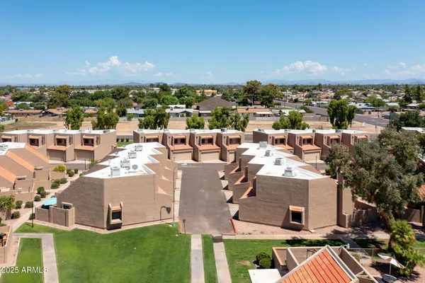 an aerial view of a house with a garden