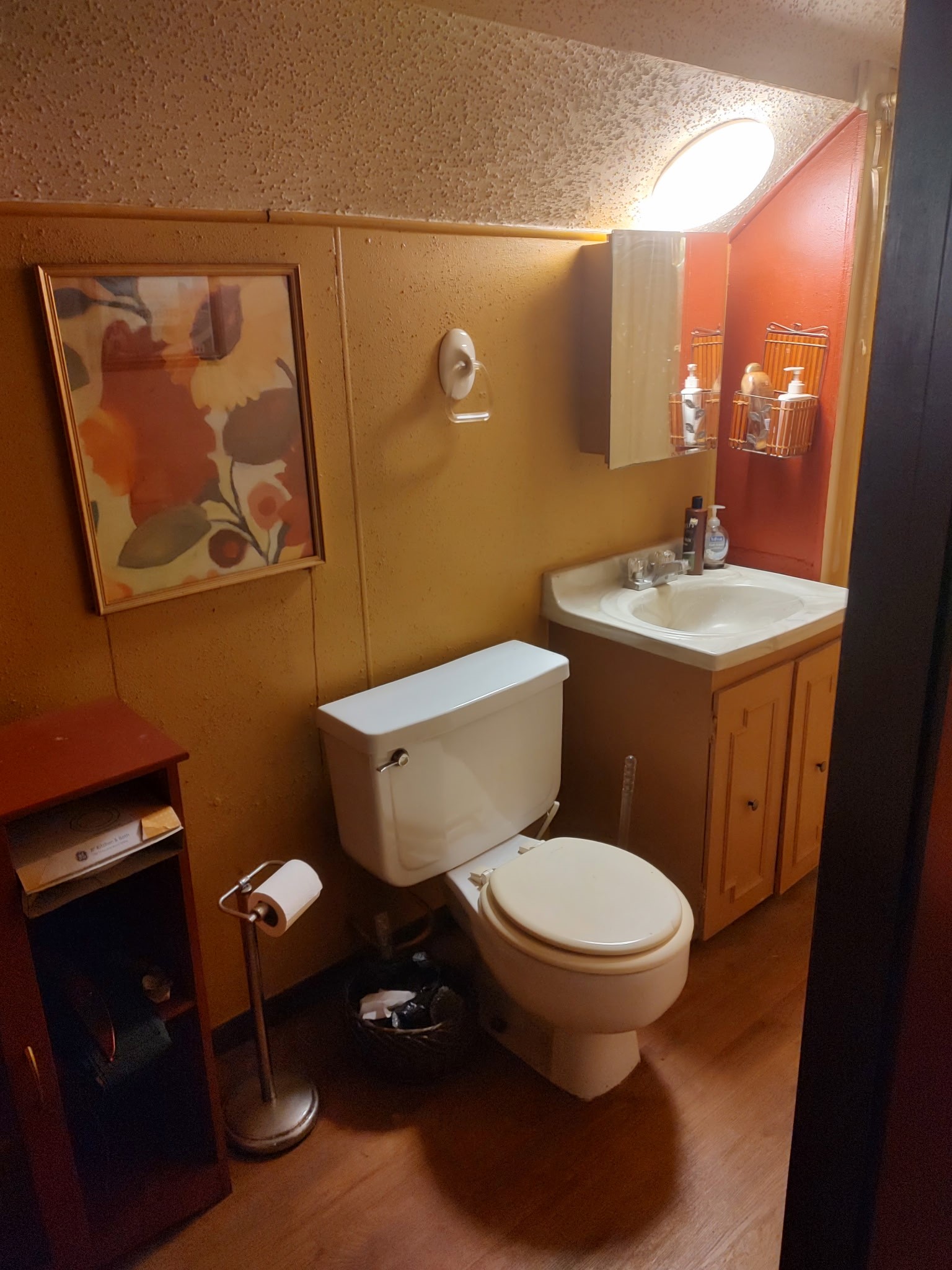 12505 Rollingwood Loop Conroe, TX 77303 - Photo 23 of 24 a bathroom with a toilet and a sink