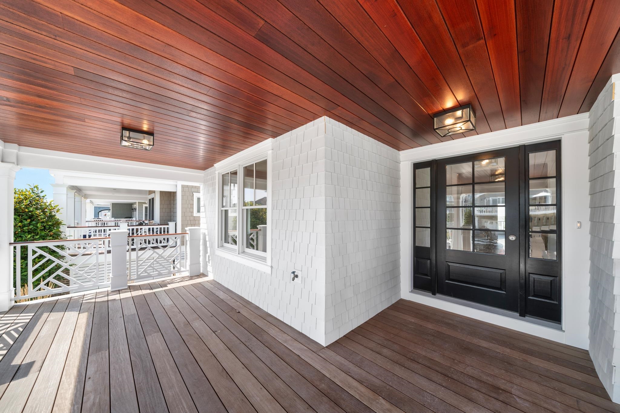 65 East 24th Avalon, NJ 08202 - Photo 11 of 49 a view of a porch with wooden floor and outer view