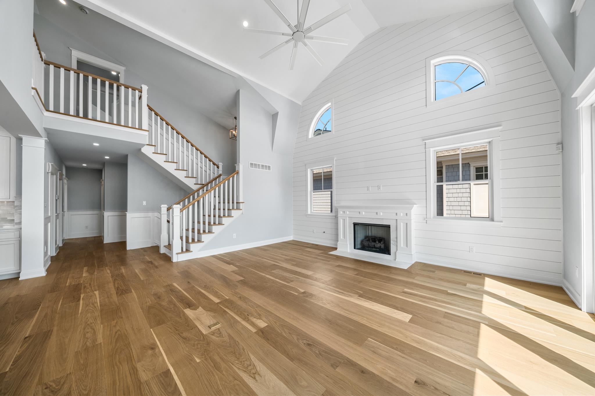65 East 24th Avalon, NJ 08202 - Photo 17 of 49 a view of a livingroom with wooden floor and a ceiling fan