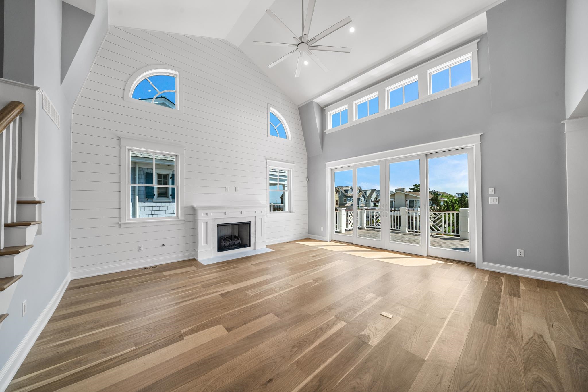 65 East 24th Avalon, NJ 08202 - Photo 18 of 49 a view of a livingroom with wooden floor fireplace and a window