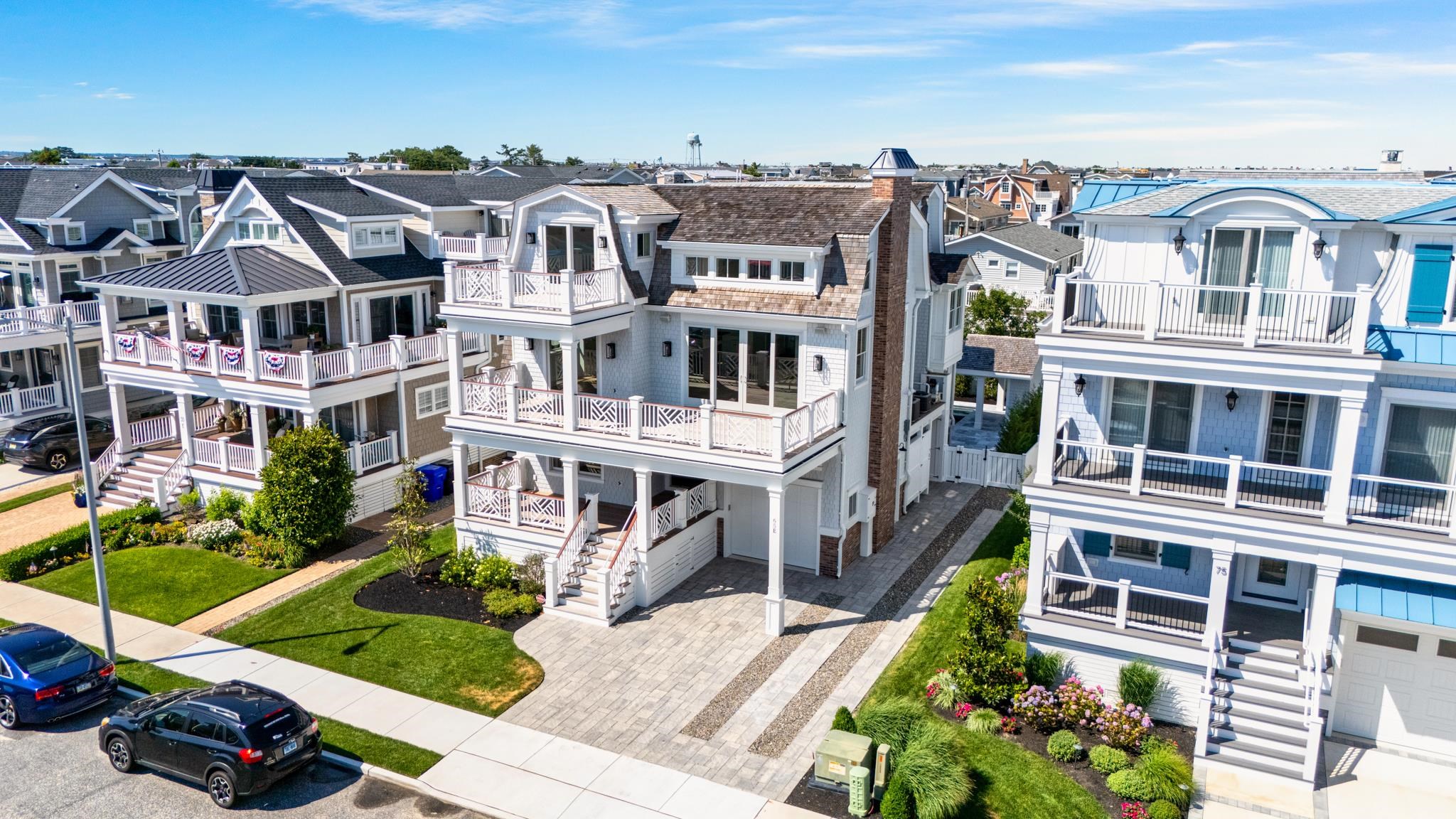 65 East 24th Avalon, NJ 08202 - Photo 2 of 49 a front view of a residential apartment building with a yard
