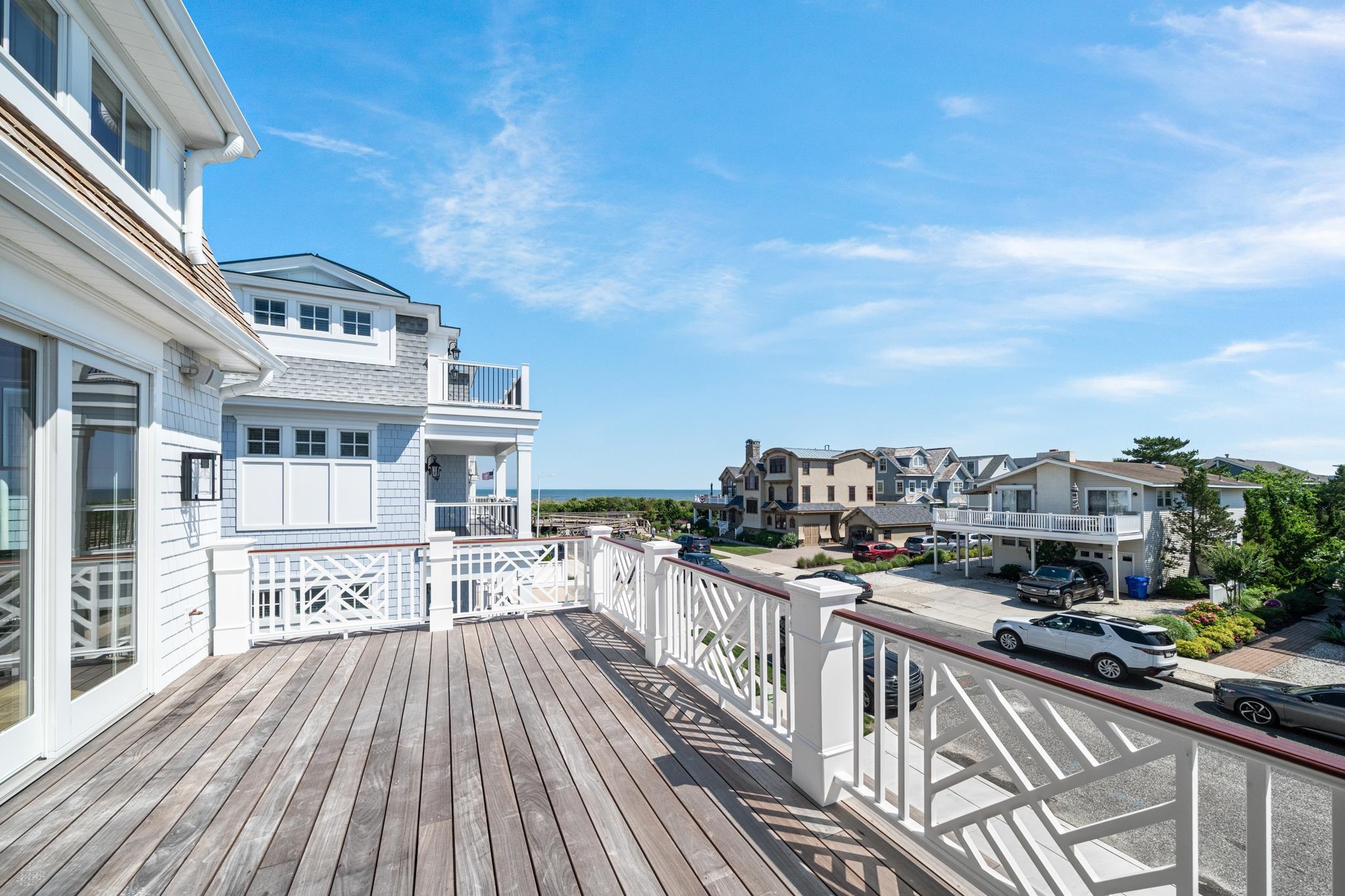 65 East 24th Avalon, NJ 08202 - Photo 24 of 49 a view of a balcony with a large window and wooden floor