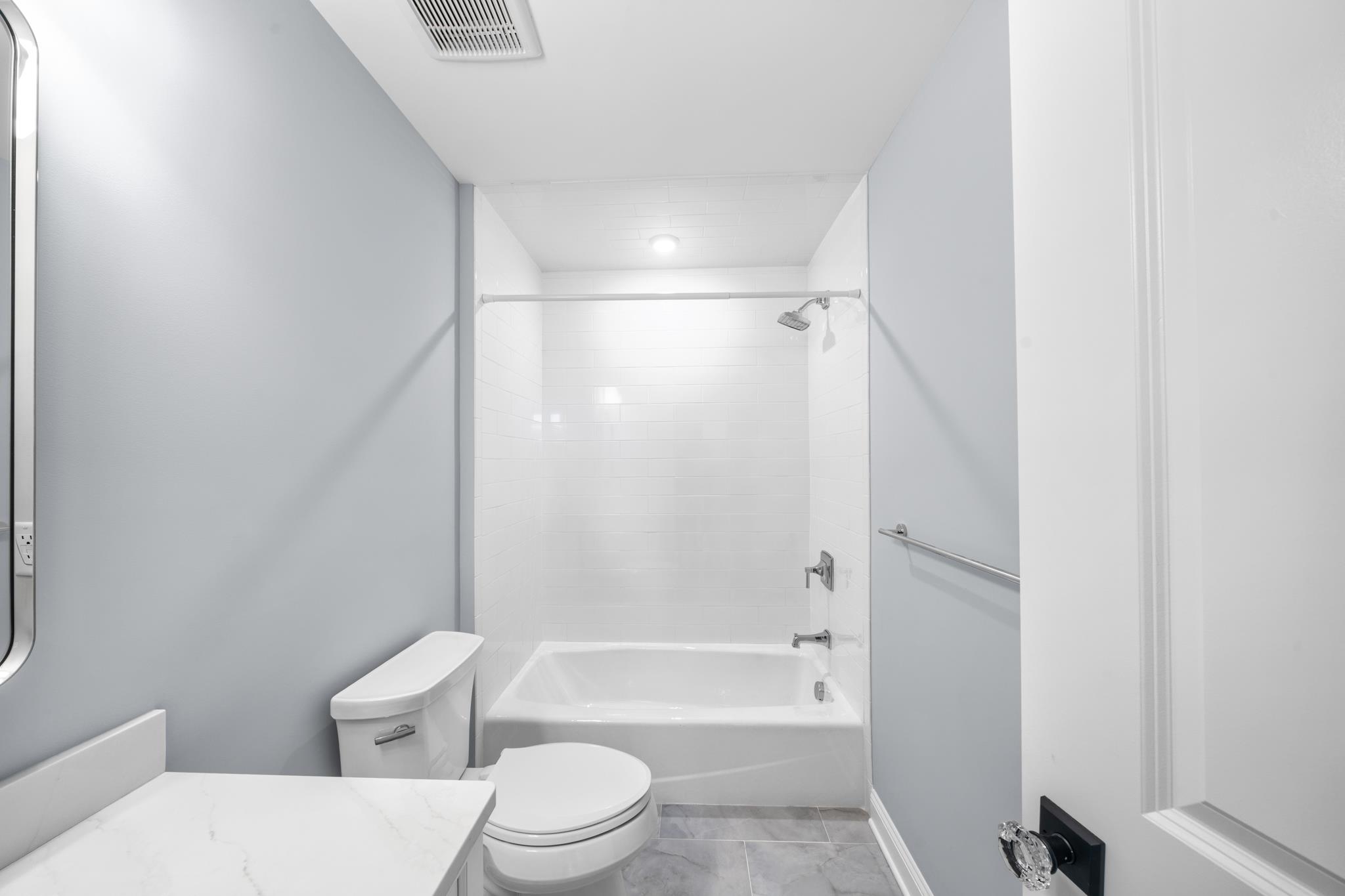 65 East 24th Avalon, NJ 08202 - Photo 31 of 49 a bathroom with a toilet and a bath tub