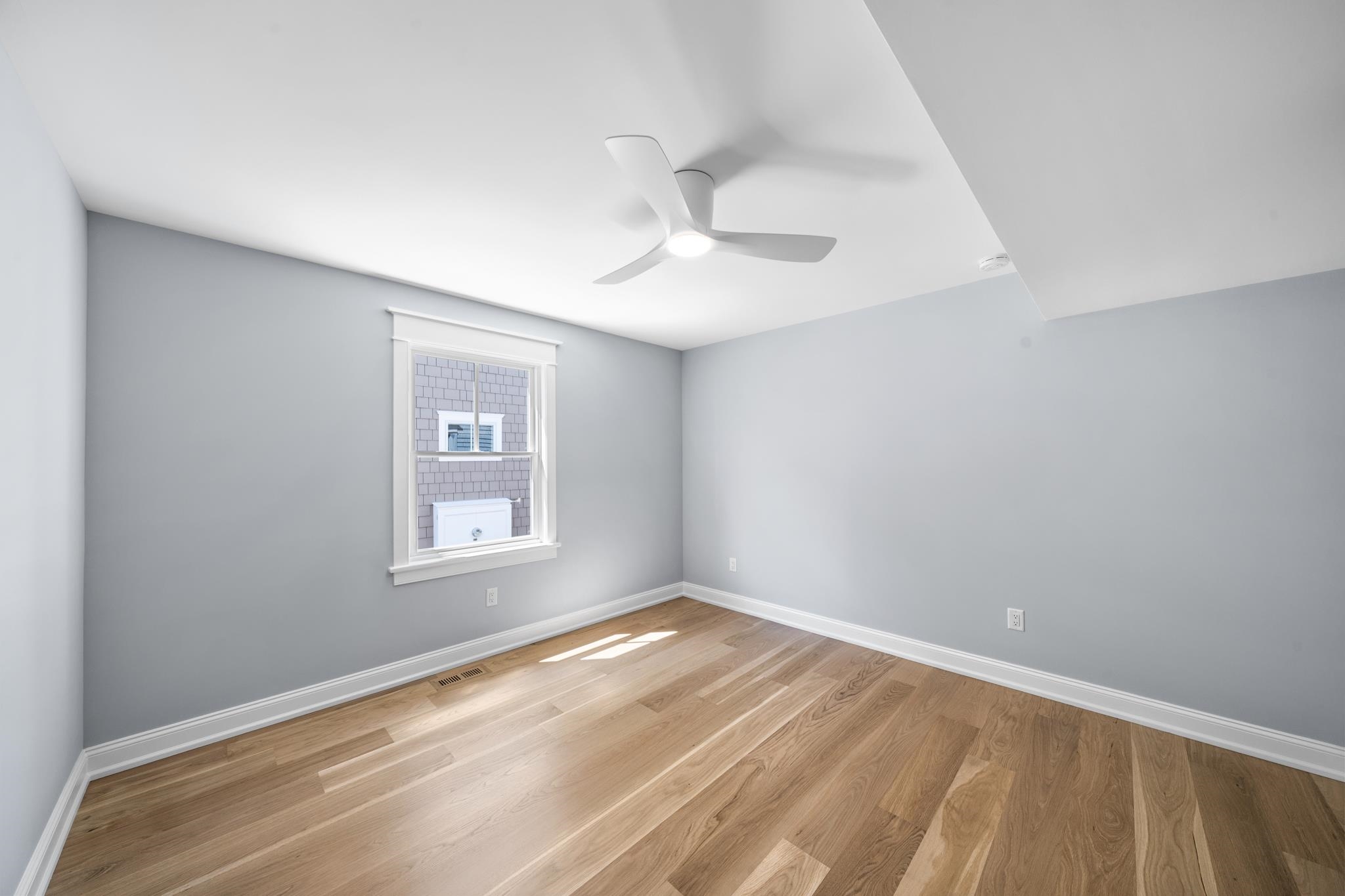 65 East 24th Avalon, NJ 08202 - Photo 32 of 49 a view of empty room with wooden floor and fan
