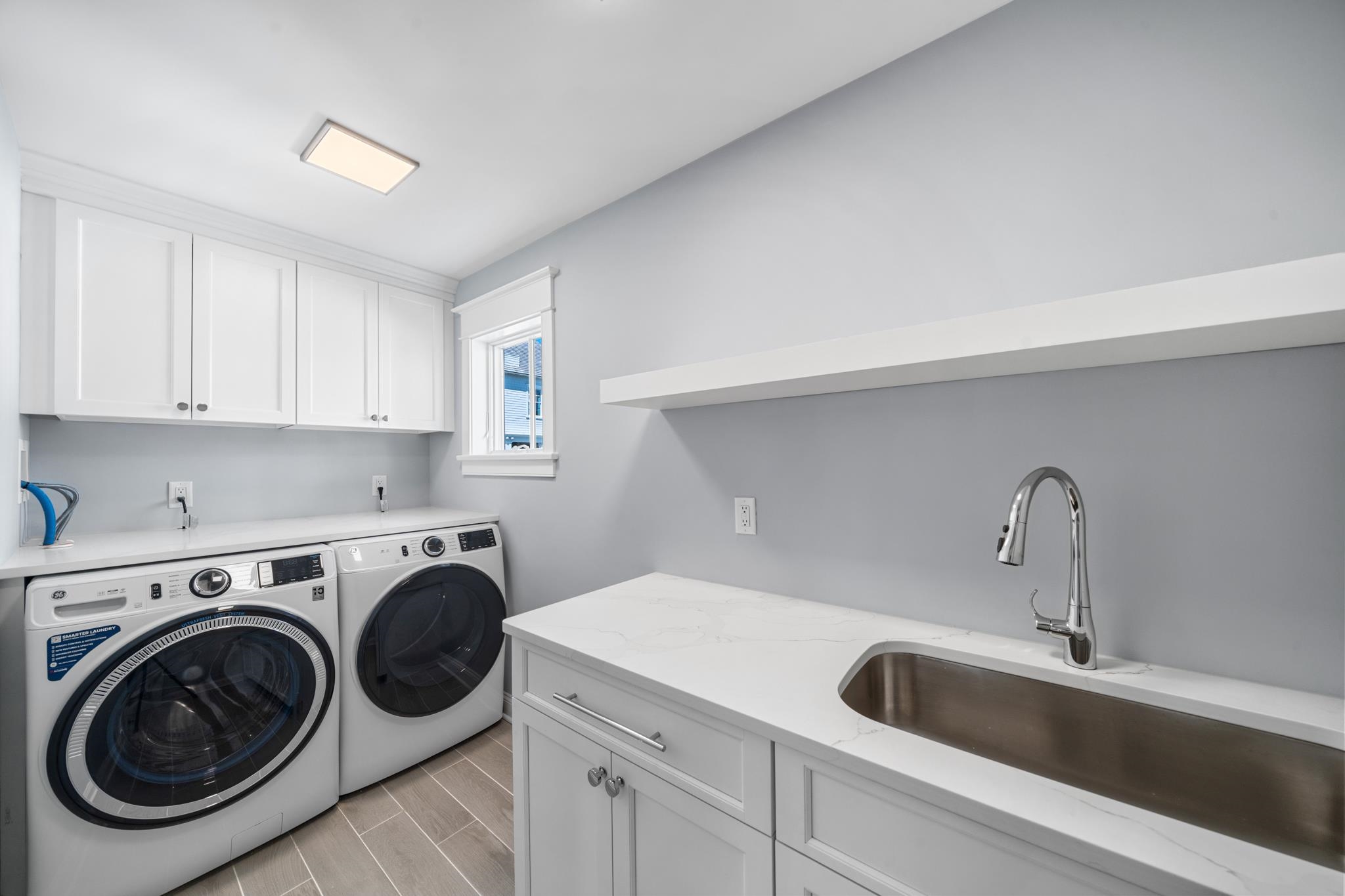 65 East 24th Avalon, NJ 08202 - Photo 34 of 49 a utility room with sink dryer and washer