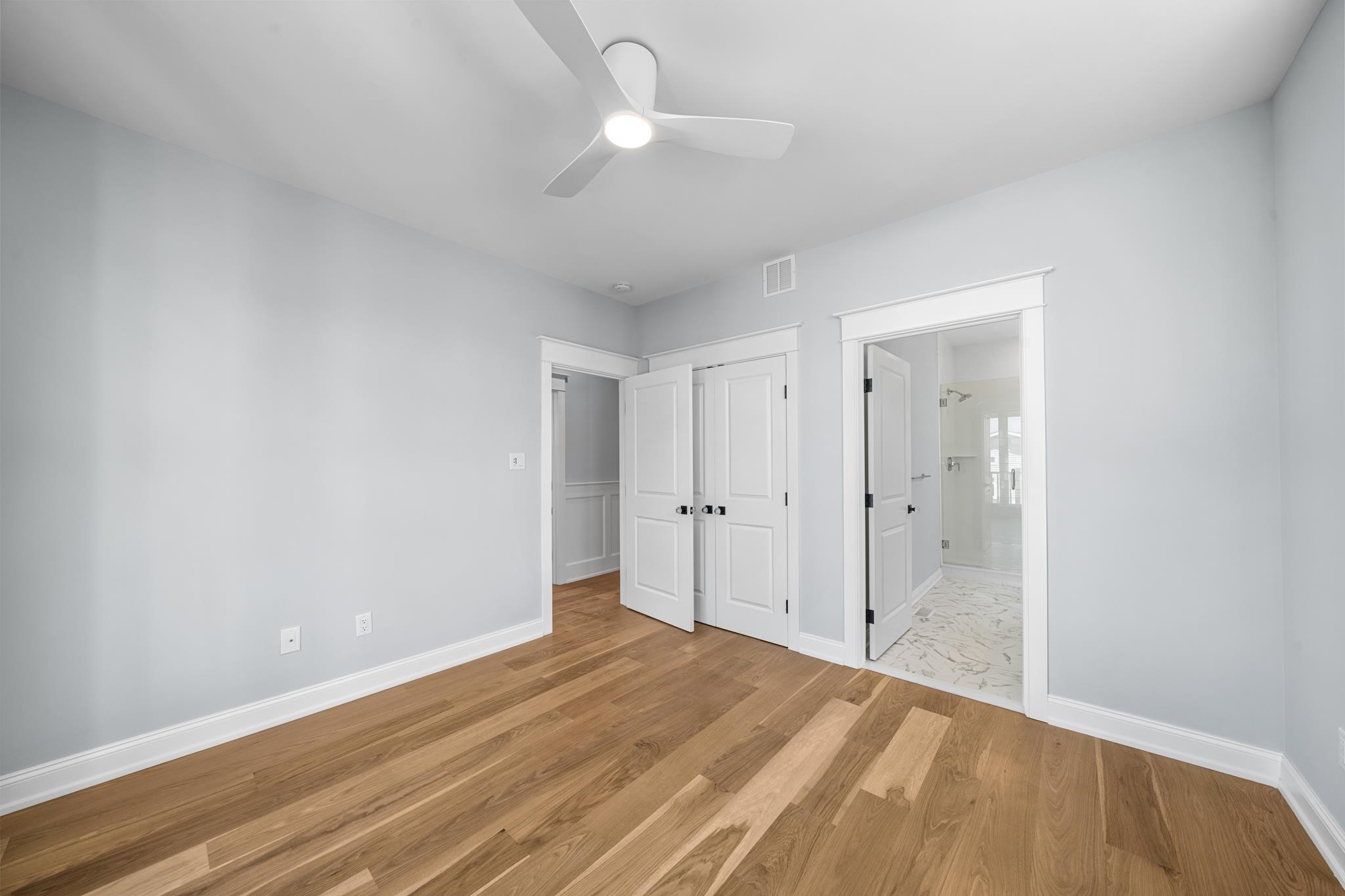 65 East 24th Avalon, NJ 08202 - Photo 36 of 49 a view of a room with wooden floor and a ceiling fan