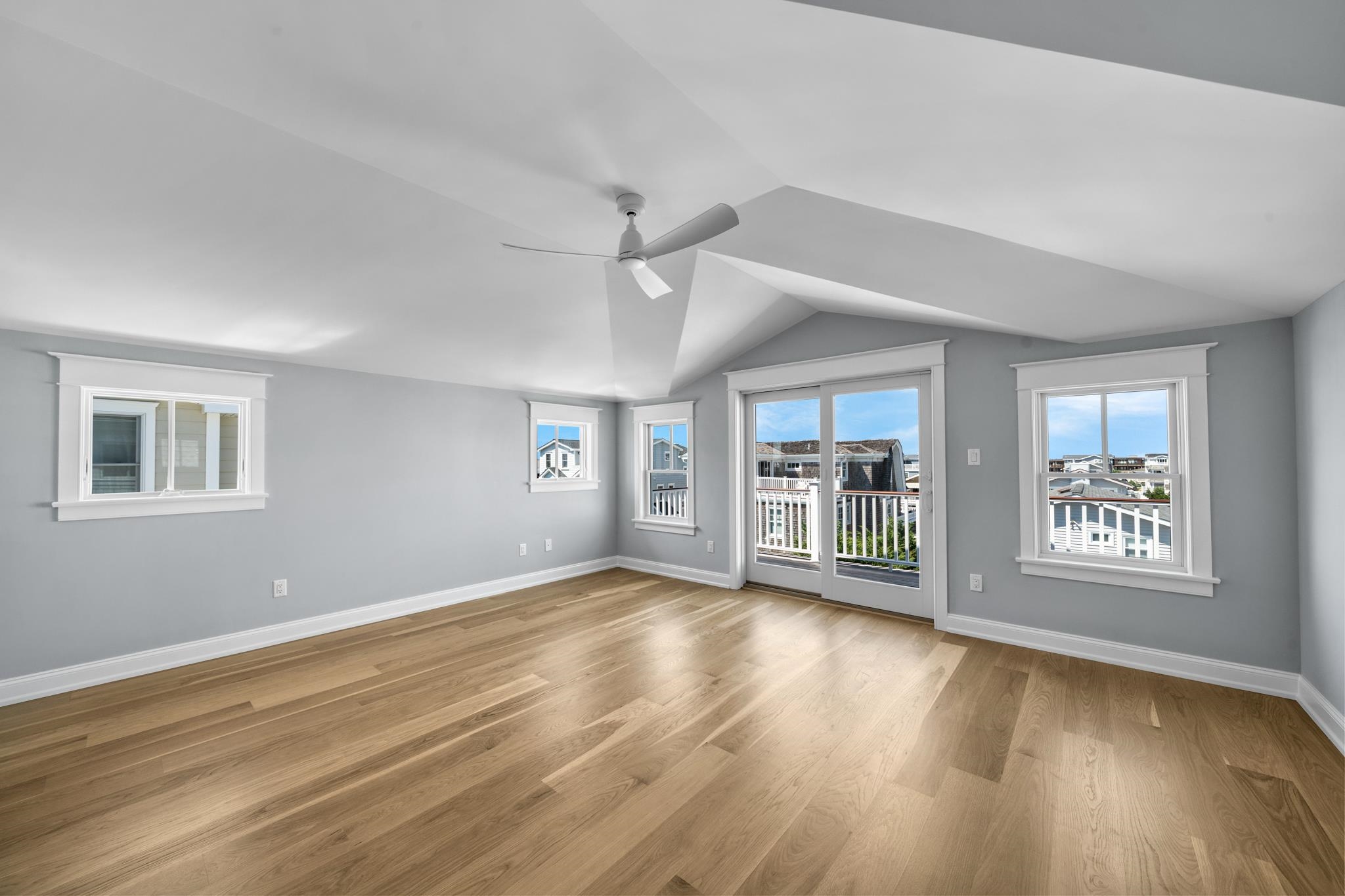 65 East 24th Avalon, NJ 08202 - Photo 42 of 49 a view of a livingroom with wooden floor and a ceiling fan