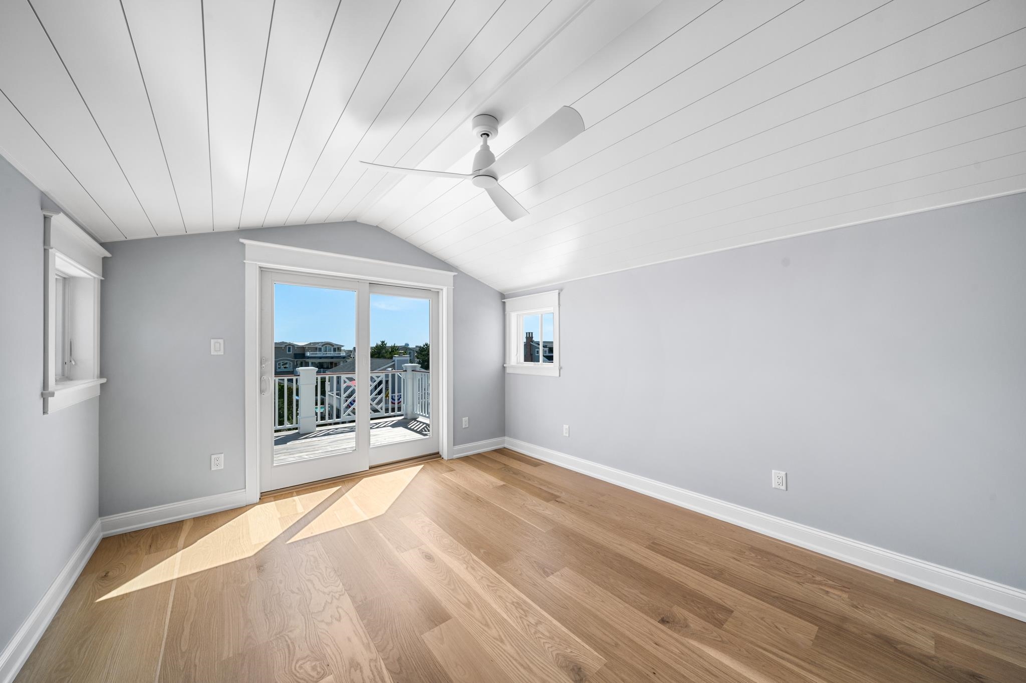 65 East 24th Avalon, NJ 08202 - Photo 46 of 49 wooden floor in an empty room with a window
