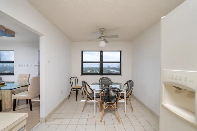 a view of a dining room with furniture and window