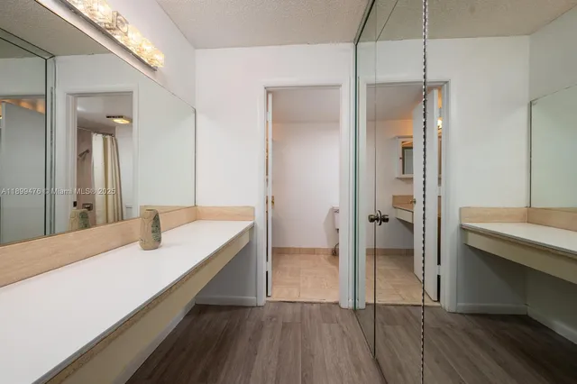a bathroom with a double vanity sink and mirror