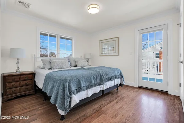 a bedroom with a bed and a table
