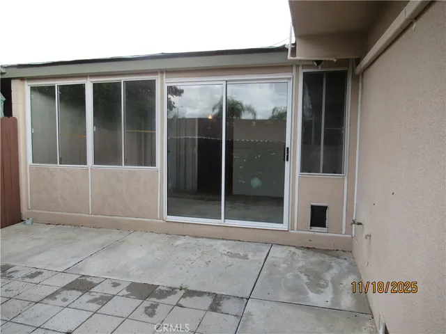 a kitchen with a sink a refrigerator and cabinets