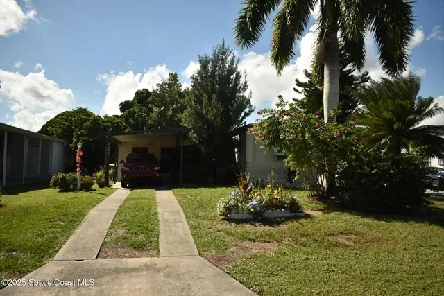 a view of a backyard with a garden
