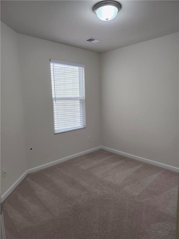 269 Sidney Lanier Avenue Athens, GA 30607 - Photo 13 of 13 an empty room with a window