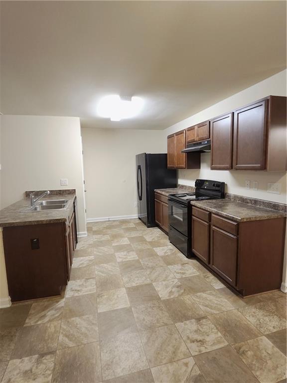 269 Sidney Lanier Avenue Athens, GA 30607 - Photo 4 of 11 a large kitchen with stainless steel appliances granite countertop a stove a sink dishwasher and a refrigerator