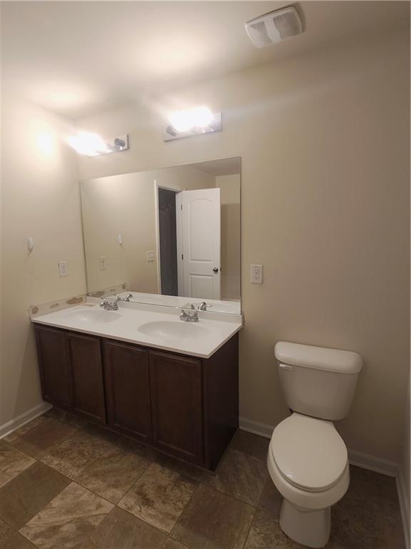 269 Sidney Lanier Avenue Athens, GA 30607 - Photo 7 of 11 a bathroom with a toilet sink and mirror