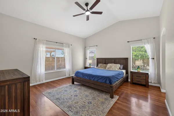 a spacious bedroom with a bed and window