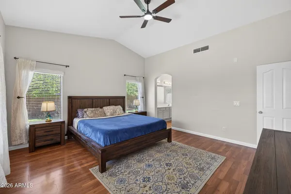 a bedroom with a bed and window