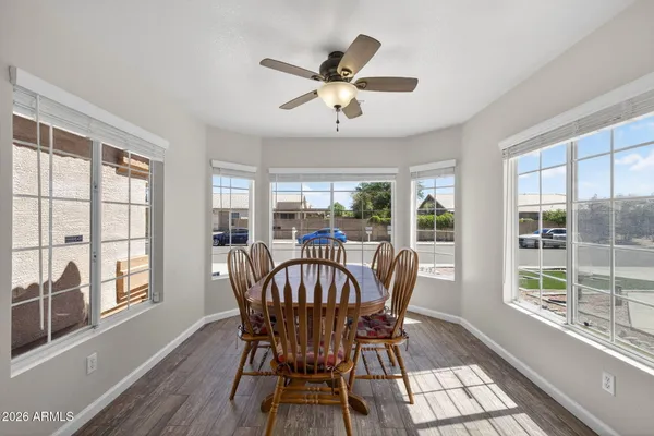 a view of a dining room with furniture window and outside view