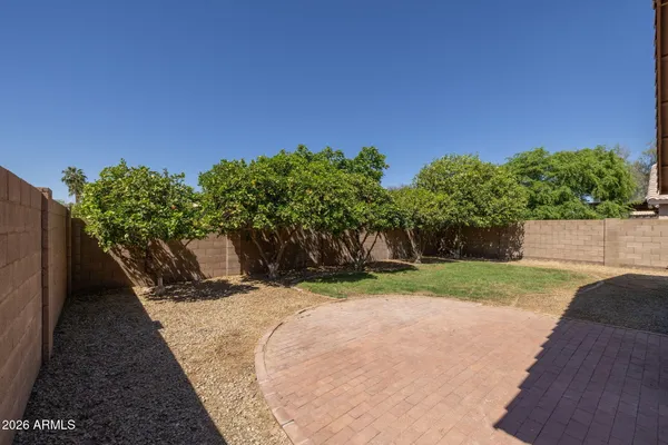 a view of a backyard with sitting area