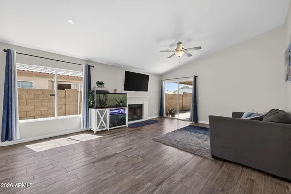a living room with furniture and a fireplace