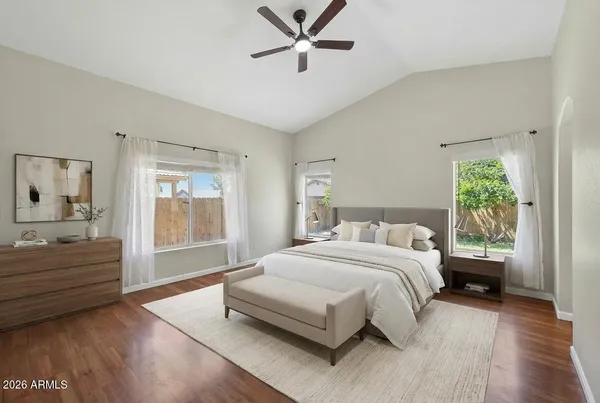 a bedroom with a large bed and a window