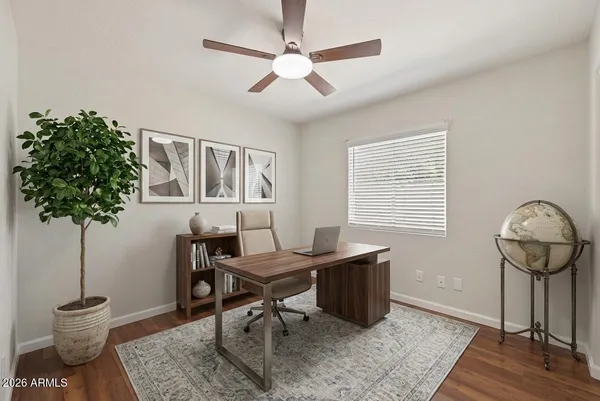 a workspace with furniture and a potted plant