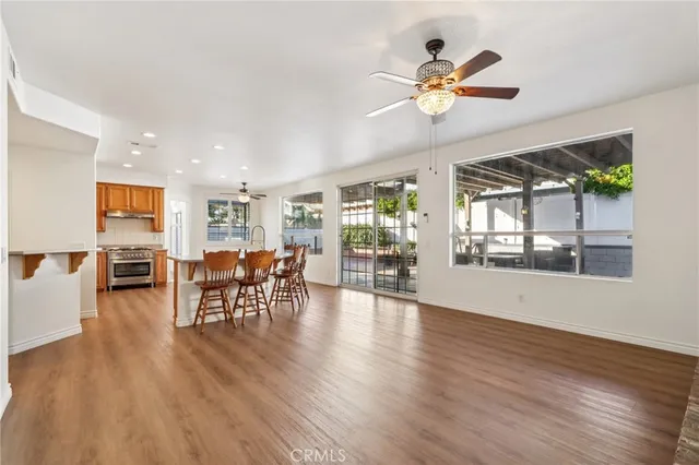 a view of dining room with furniture and wooden floor