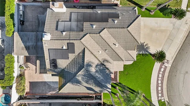 an aerial view of a house with a garden and stairs