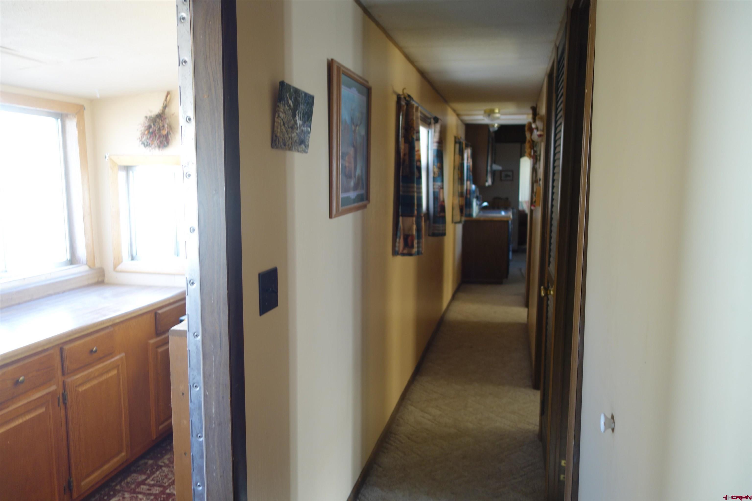 28357 Highway 50, Unit 104 Gunnison, CO 81230 - Photo 20 of 26 Hallway looking back towards kitchen