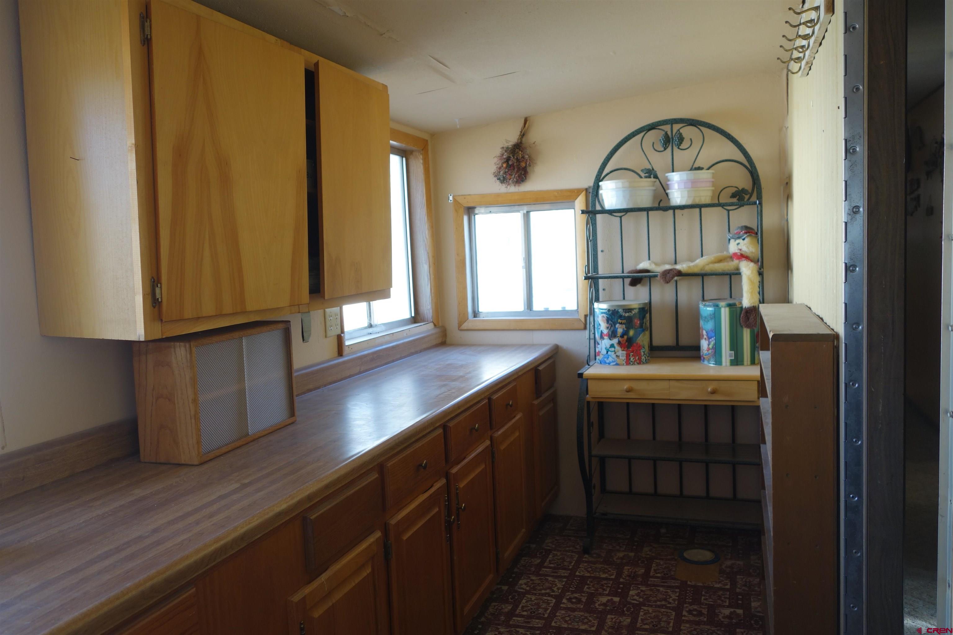 28357 Highway 50, Unit 104 Gunnison, CO 81230 - Photo 23 of 26 Utility Room leads to the back door