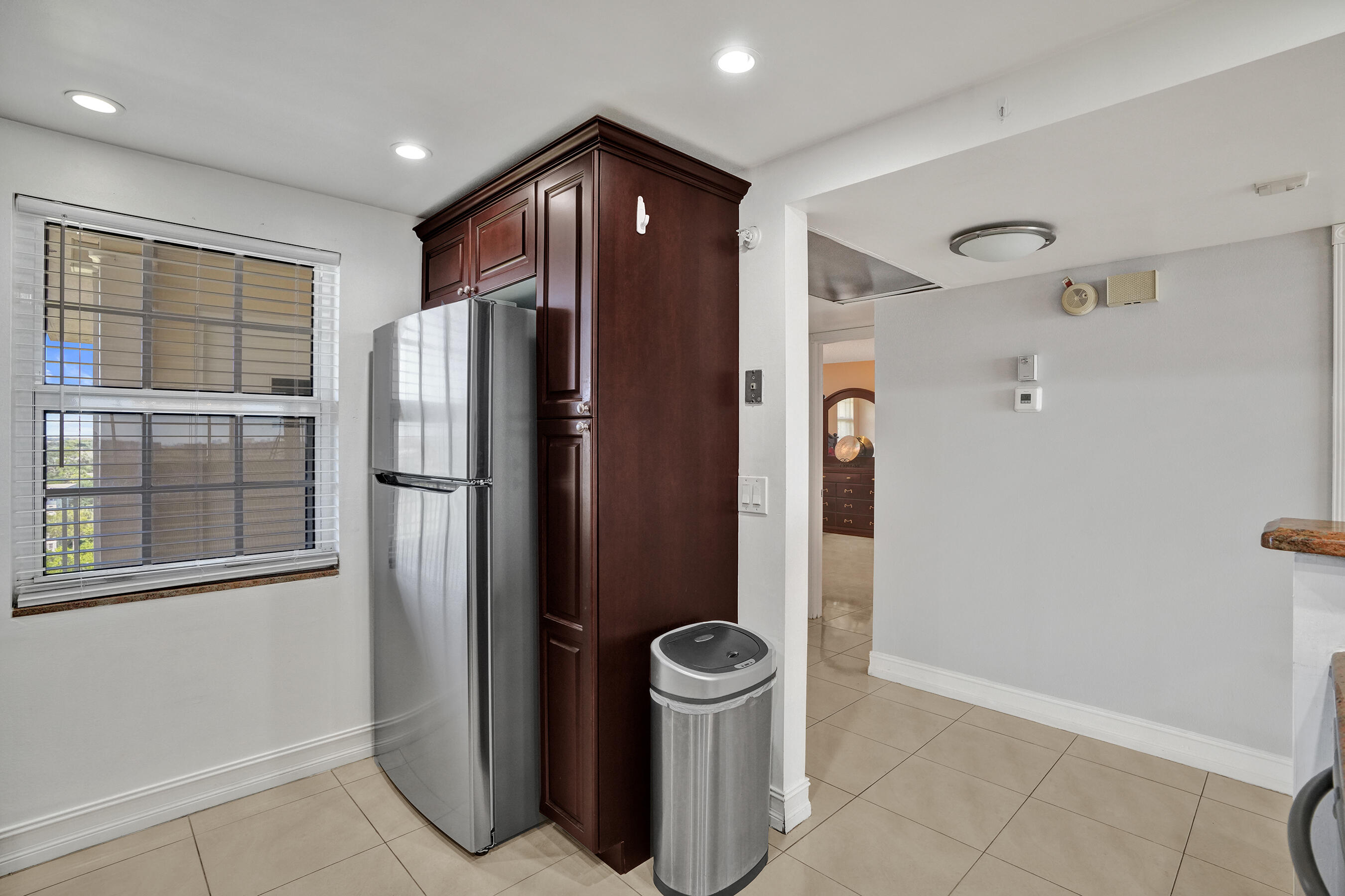 3520 Oaks Way, Unit 1010 Pompano Beach, FL 33069 - Photo 16 of 67 a metallic refrigerator freezer sitting in a kitchen