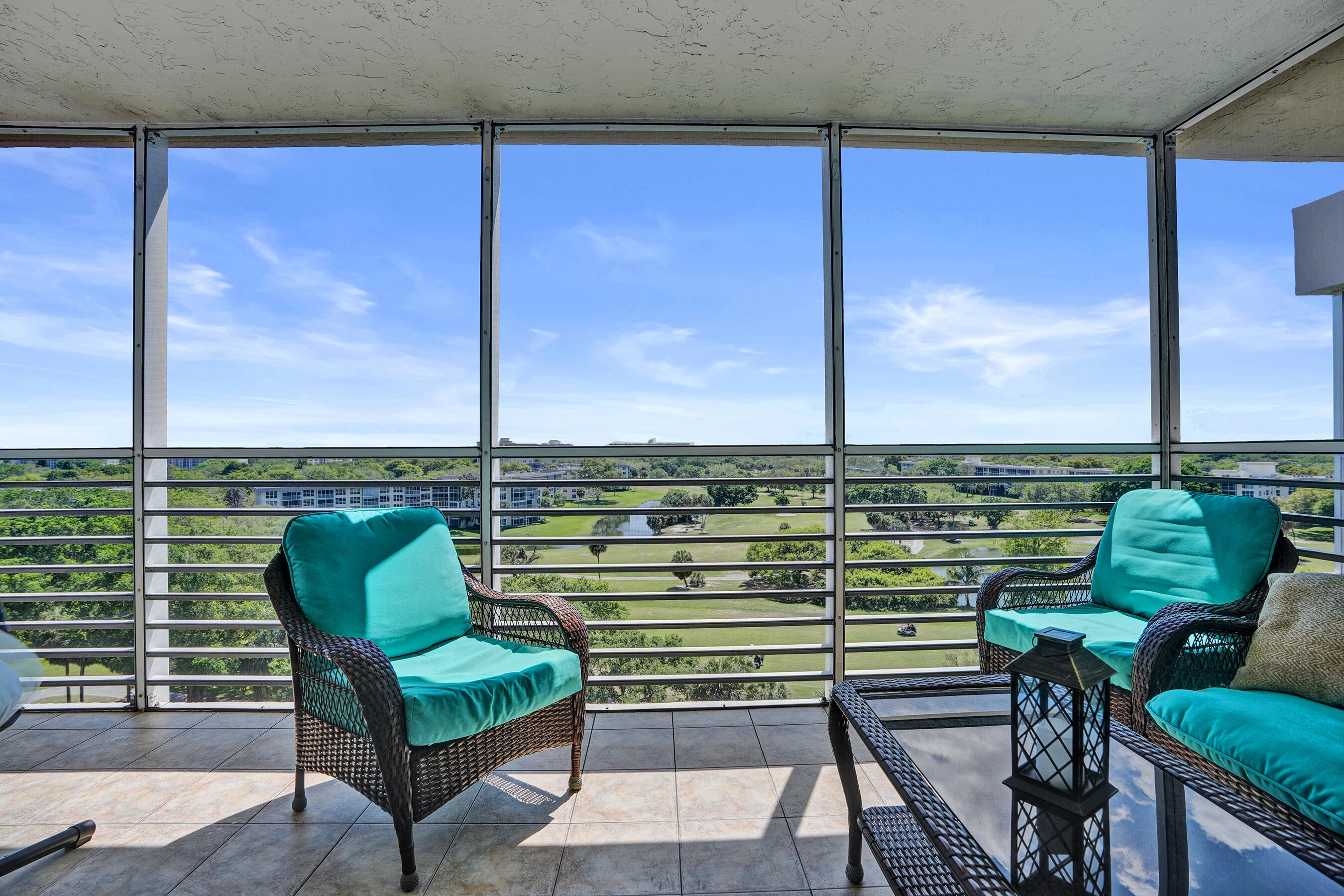 3520 Oaks Way, Unit 1010 Pompano Beach, FL 33069 - Photo 29 of 67 a view of a chairs in a balcony