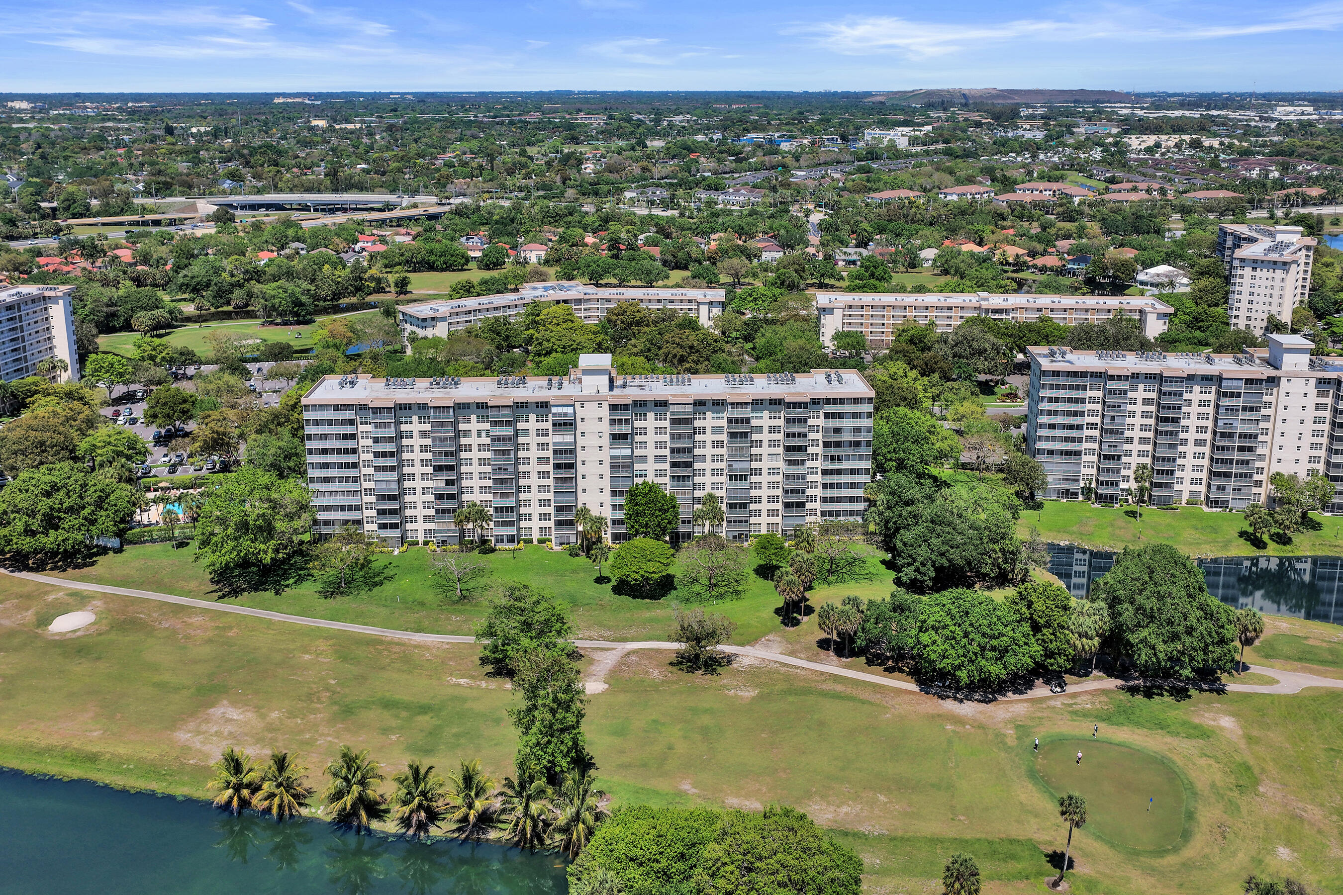 3520 Oaks Way, Unit 1010 Pompano Beach, FL 33069 - Photo 35 of 67 an aerial view of a residential houses with outdoor space and lake view