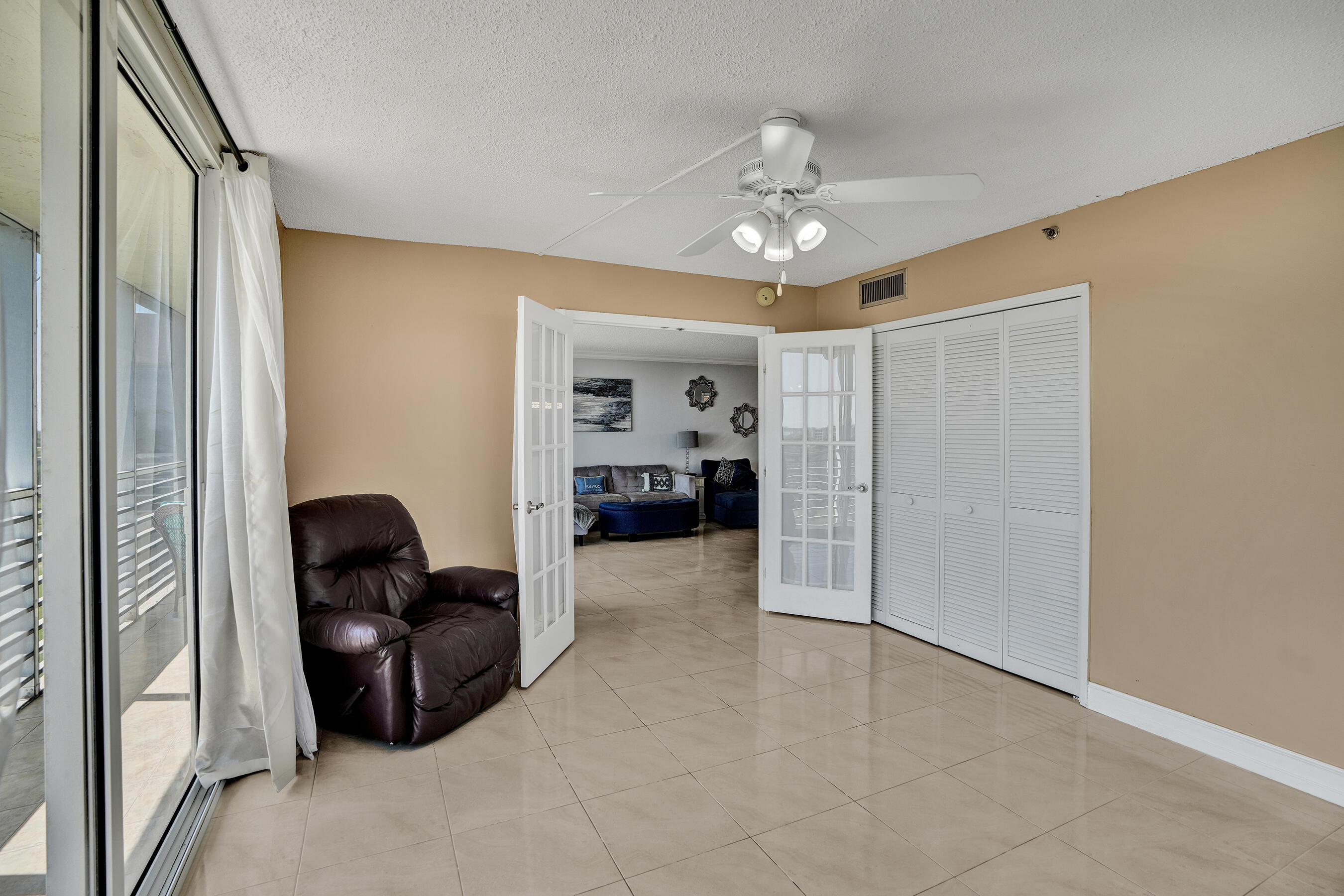 3520 Oaks Way, Unit 1010 Pompano Beach, FL 33069 - Photo 40 of 67 a view of livingroom with furniture and ceiling fan