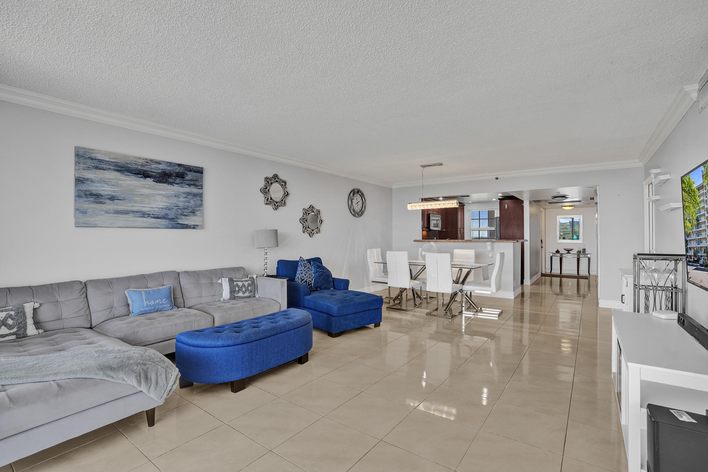 3520 Oaks Way, Unit 1010 Pompano Beach, FL 33069 - Photo 42 of 67 a living room with furniture and wooden floor