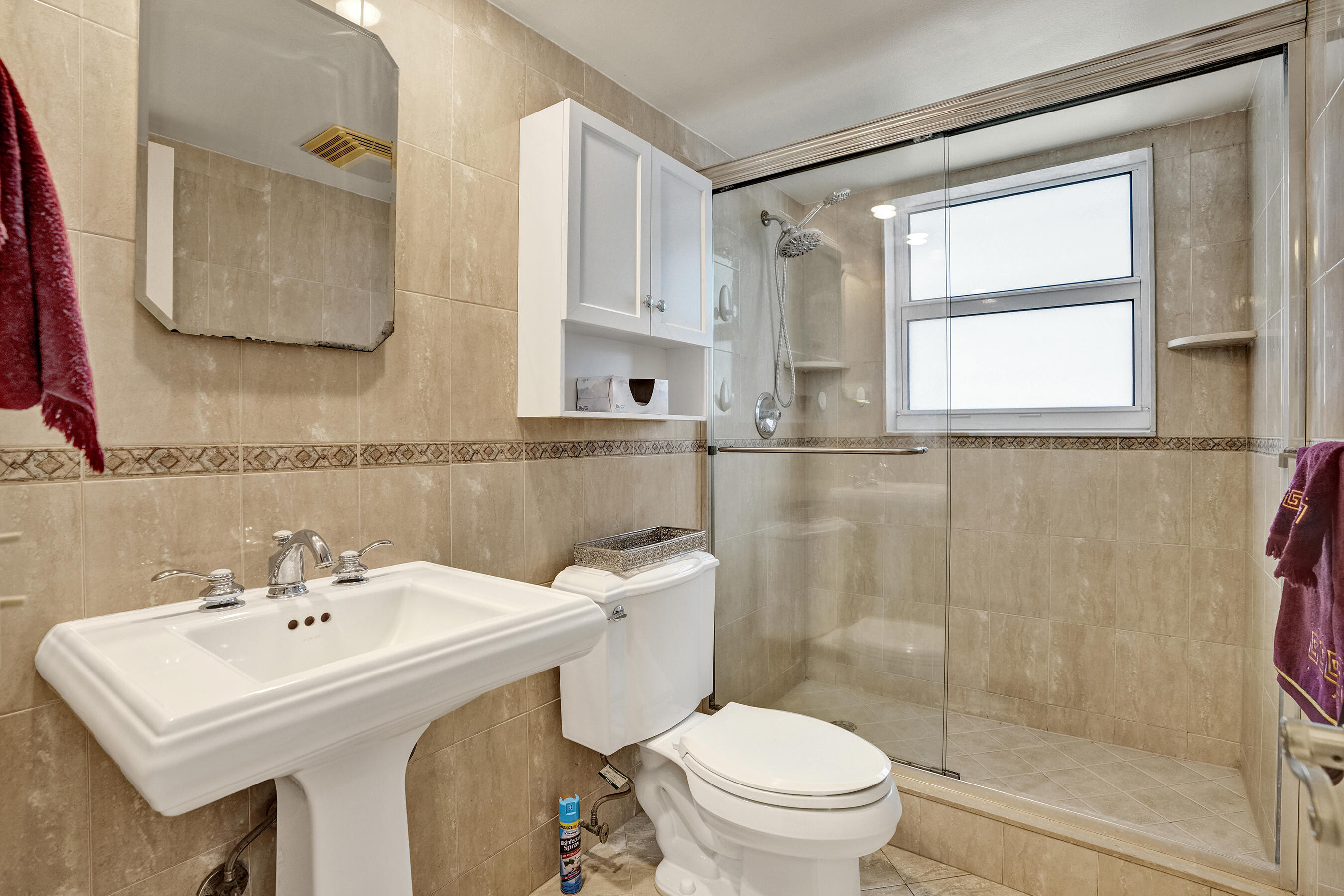 3520 Oaks Way, Unit 1010 Pompano Beach, FL 33069 - Photo 46 of 67 a bathroom with a sink a toilet and shower