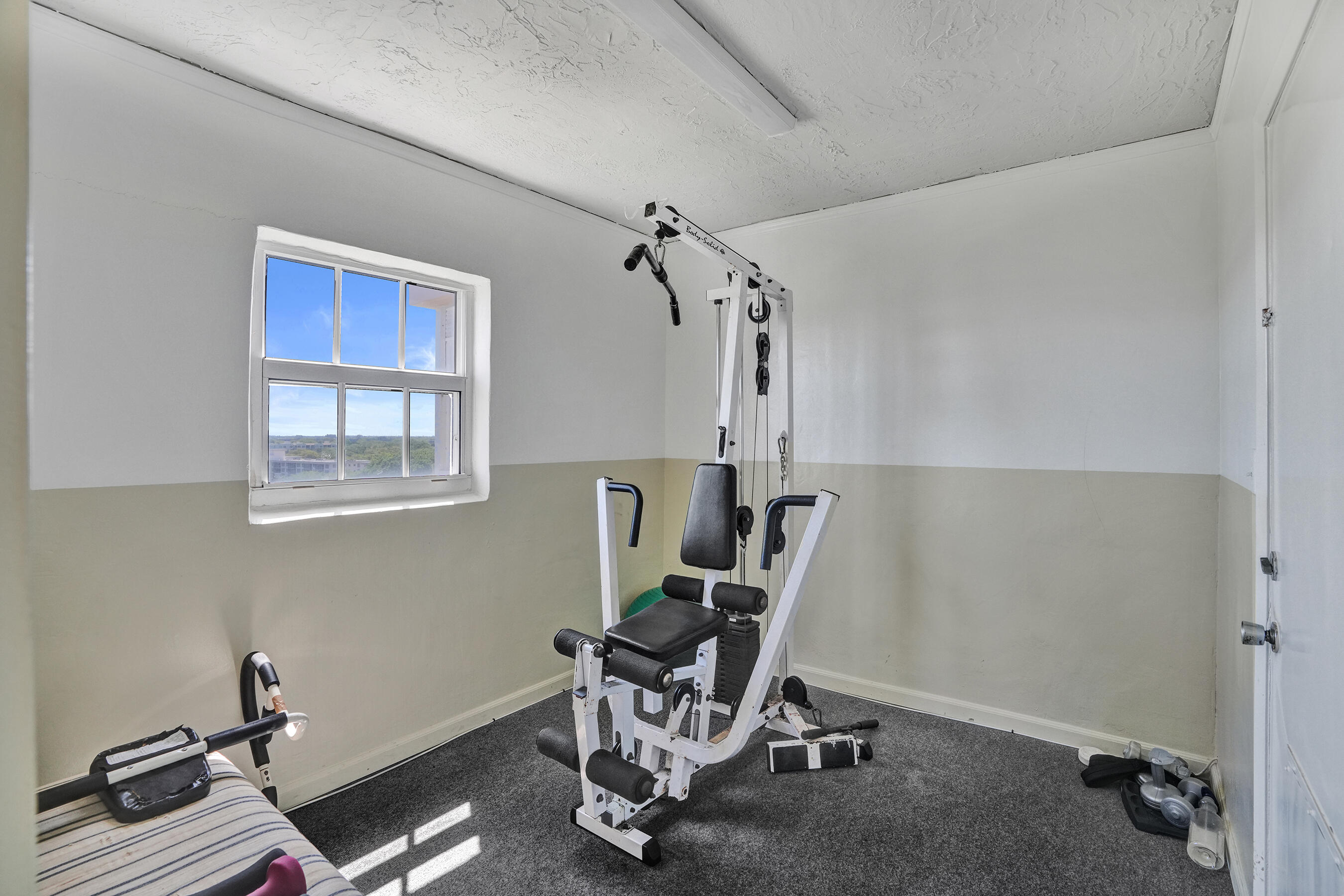 3520 Oaks Way, Unit 1010 Pompano Beach, FL 33069 - Photo 54 of 67 a view of a workspace with furniture and a window