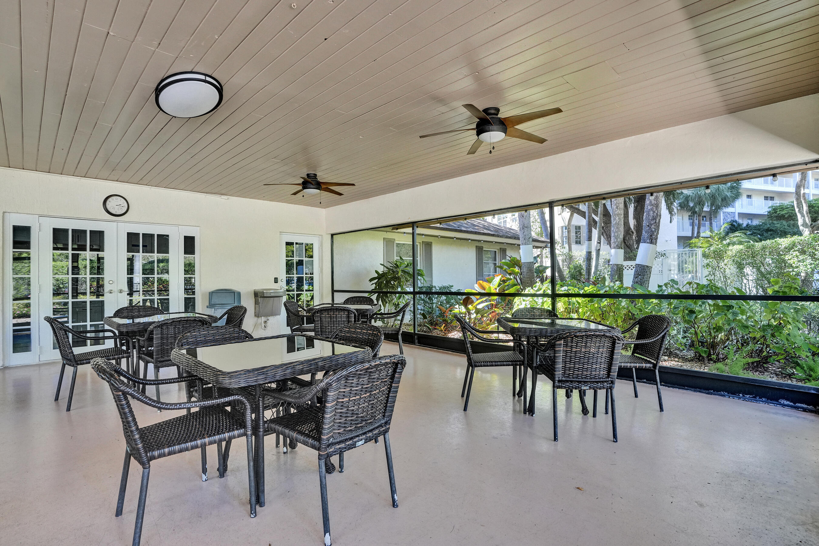 3520 Oaks Way, Unit 1010 Pompano Beach, FL 33069 - Photo 59 of 67 a view of a dining room with furniture window and outdoor space