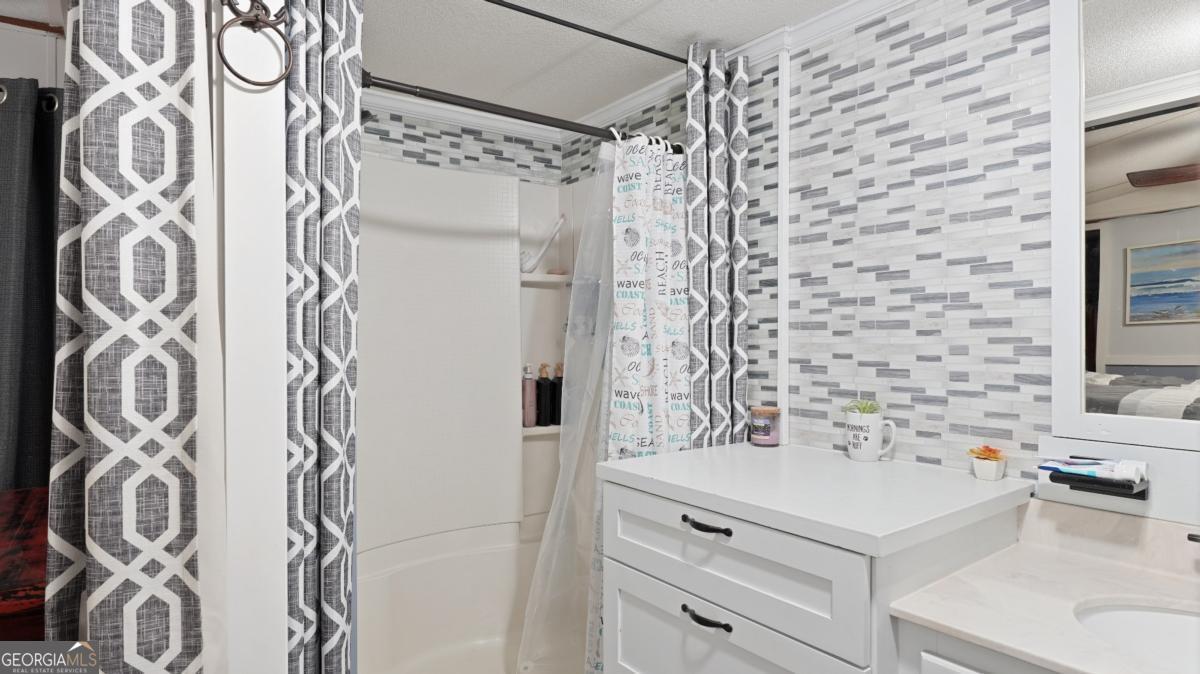 4866 Kville Road Screven, GA 31560 - Photo 27 of 39 a bathroom with a sink and a mirror