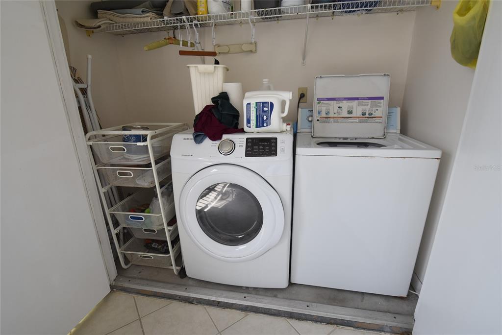 1512 Pelican Point Drive, Unit BA264 Sarasota, FL 34231 - Photo 11 of 44 a utility room with dryer and washer