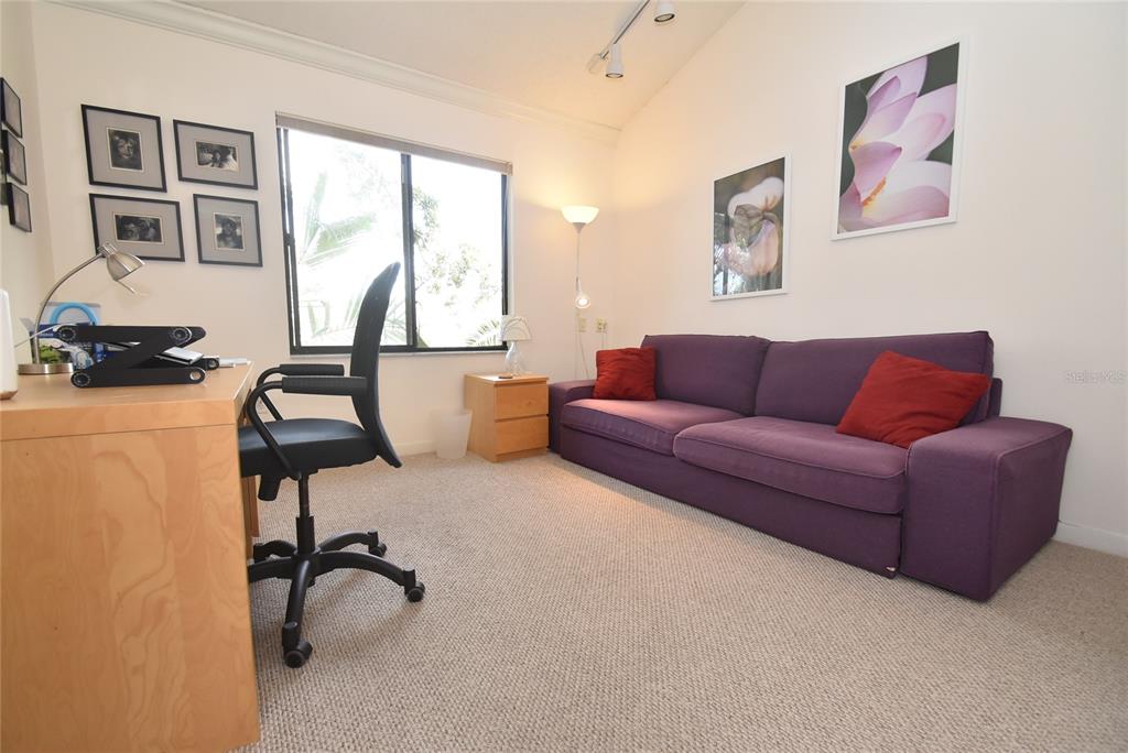 1512 Pelican Point Drive, Unit BA264 Sarasota, FL 34231 - Photo 14 of 44 a living room with furniture and window