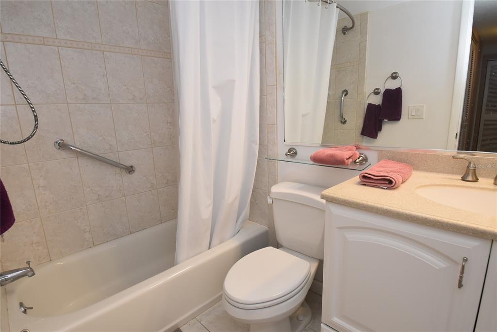 1512 Pelican Point Drive, Unit BA264 Sarasota, FL 34231 - Photo 15 of 44 a bathroom with a sink toilet and shower