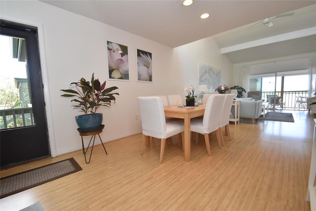 1512 Pelican Point Drive, Unit BA264 Sarasota, FL 34231 - Photo 2 of 44 a view of a dining room with furniture window and wooden floor